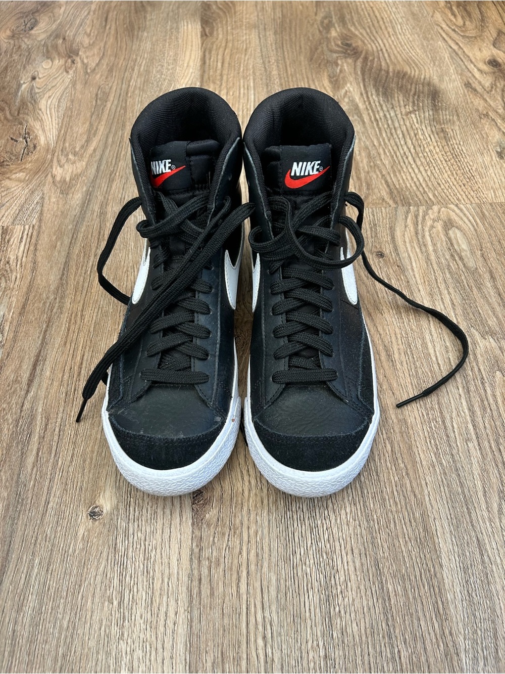 Nike Black High-Top Sneakers with White Swoosh and Red Logo